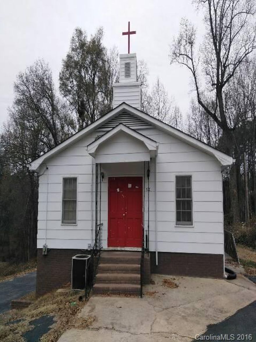 Private Church commercial property on wooded 2.26 acres. Utilities are all electric, there are 3 classrooms and 2 baths downstairs, auditorium and 1 bath upstairs. Roof is approx. 2 years old.