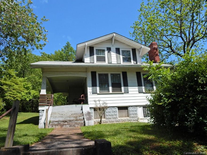 Investors dream location.(fixer Upper). 2 story home full of charm and character with hardwood floors thru out., 2 sets of glass french doors. huge covered porch taking you back to yester year. . Large level lot and what a Bonus location !!! It is across the street from Fletcher  Hall Park plus you can walk to New Belgium Brewery. AS- IS