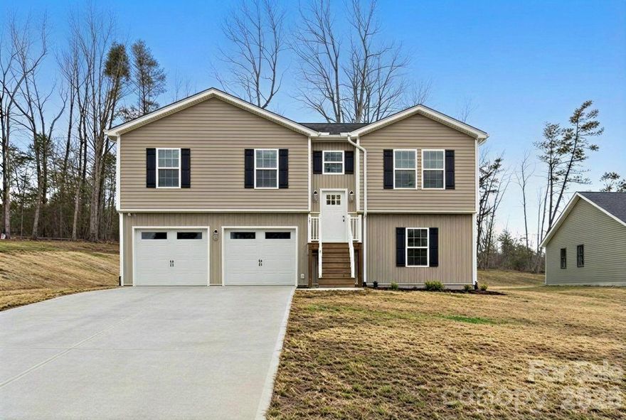 This is a must-see! An unexpected relocation has brought this newly enhanced gem back to the market—and it is truly better than new. Originally built in 2025, this stunning Granite Falls home features a desirable 3-bedroom, 2-bathroom split-foyer floor plan that has that has been transformed over the last four months with numerous high-end upgrades.
The primary level showcases a bright, open floor plan perfect for entertaining. The gourmet kitchen is a standout, featuring custom Shaker cabinetry, an expansive center island, elegant quartz countertops, and a suite of premium stainless steel appliances. Retreat to the spacious primary bedroom, complete with a generous walk-in closet and a private, modern bath. Designed for both convenience and versatility, the oversized two-car garage provides direct entry into a finished lower level featuring two flexible rooms. 
Since closing in November 2025, the property has undergone meticulous, high-capital enhancements. The current owners spared no expense in their improvements, investing heavily in premium upgrades that far exceed standard builder grade. These include a massive, professionally poured concrete driveway, a custom rear patio slab for sophisticated outdoor living, and a upgraded top-of-the-line Frigidaire Gallery french door refrigerator. Additionally, professionally engineered yard sloping for superior foundation protection, and luxury fixtures in every room.  A specialized freeze-proof outdoor faucet, providing the rare luxury of both hot and cold water for year-round outdoor use has also been added to the property.
This is a rare opportunity to own a virtually new home with major, high-cost post-closing improvements already completed to the highest standard. This property is truly move-in ready—schedule your showing today because this home won't last!