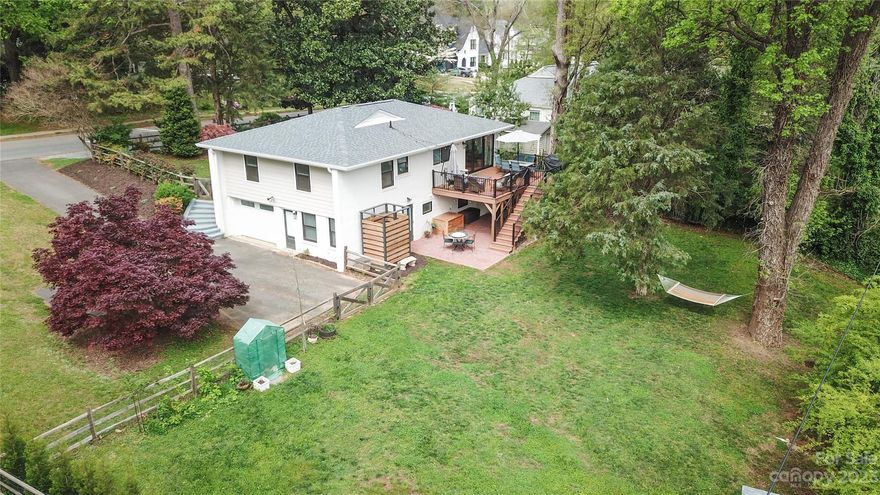 Beautifully remodeled bungalow w/ rare finished walkout daylight basement! Situated in high demand Sedgefield this 4BR home is loaded w/ new upgrades & features which include all NEW: Roof '22,
 Composite deck, Windows & Doors, Hardwood flooring main, & Vinyl plank flooring down, Fully renovated kitchen w/ Quartz countertops, Siding, Custom bathrooms, Tile floors, Updated lighting, Cable railing staircase, the list goes on. Meticulously renovated w/ attention to detail. Luxurious primary bedroom & bath w/ floor to ceiling tiled shower, large walk-in closet & built in safe. Freshly painted brick exterior. New deck overlooks a large fully fenced yard w/ new brick paver patio & custom outdoor shower w/ hot water.  Tons of storage in 1 car garage.  New shed for extra storage. Prime location close to everything Southend & Dilworth has to offer w/ true walkability to restaurants, Starbucks & the light rail. This house is turnkey, pre-inspected, & move in ready!