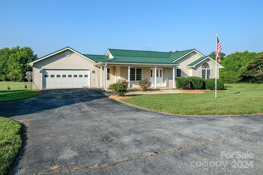 Move right in! Home Features 3 Bedrooms and 2 Full Baths. Separate Laundry room with utility sink. Level entry from 2 car garage, 21 x 22 deep.  Rear of property is directly behind local winery. Picturesque views off beautiful New Rear Deck 19.5 x 7!  Vaulted ceiling in Living Room.  Hardwood Floors throughout.  Storage shed, 10 x 12. Minutes to interstate, shopping and amenities.  New Heat Pump January 2024.  Crawlspace encapsulation August 2024.