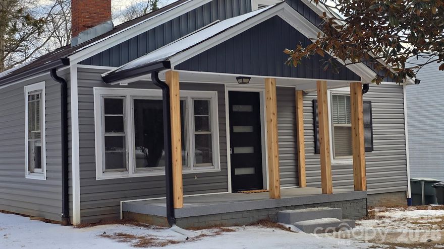 This tastefully styled Bungalow was completely remodeled with an additional un-permitted bedroom and bathroom added in 2025. This 3/2 is within walking distance of multiple restaurants, bars, a gym, City Parks, the Conover Library, I-40 and much more!! This house has two fully remodeled bathrooms, luxury vinyl plank flooring, beautiful custom cabinets with granite countertops, a built in coffee bar, in unit laundry and more!! The home had a new central HVAC installed in 2025, 200 amp electrical panel, EV car charger, Vinyl siding, multiple new windows, complete pex plumbing, large capacity water heater along with multiple other additions to make this house comfortable for its new owner. Make yourself a cup of coffee and enjoy the view from your covered front porch! Fireplace is inoperable and is boarded up.