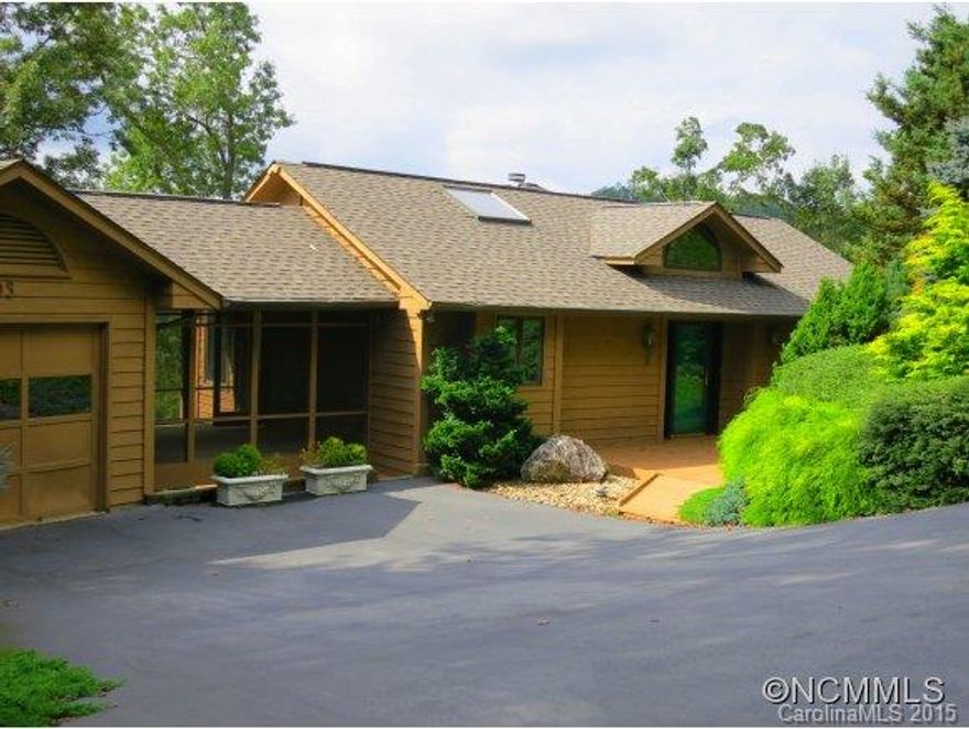 The ultimate view overlooking a cascade of mountain ranges+Lake Wanteska. Impressive 2.76 acres professionally landscaped w/specimen shrubs. Designed for entertaining w/immense kitchen, flr-to-ceiling Paladium windows + unique 24x10 former art gallery. Lavish Master w/sitting area & marble flr. bath. Hardwood floors, stone FP, granite counters + lg.breezeway. Recently painted thruout & new guest bath upstairs. Separate art studio/Bonus Rm on LL