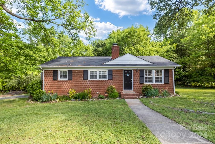 Embrace the potential of this 3-beds, 1 bath ranch home nestled in the welcoming neighborhood of Whispering Pines in Charlotte. This full brick ranch, though in need of renovation, holds promise as a serene retreat on a private lot. Step inside to discover a seamless blend of elegance and functionality, where hardwood floors grace the living areas, creating an inviting ambiance throughout. The spacious layout is thoughtfully designed, featuring generously sized bedrooms and bathrooms that ensure everyone's comfort. The heart of the home lies in its exceptional kitchen, boasting ample counter and cabinet space for all your culinary adventures. Stay comfortable year-round with central HVAC and a programmable thermostat, providing personalized climate control to suit your preferences. Outside, a spacious yard awaits, offering endless possibilities for outdoor enjoyment and relaxation. Embrace the journey of revitalizing this home and unlocking its full potential.