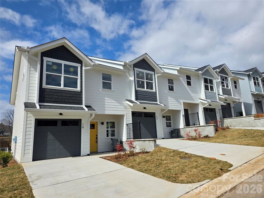 Discover West Asheville’s newest townhome community, Westview Village. Nestled amidst scenic rolling pastures just 4.3 miles from downtown Asheville. This exclusive collection of 26 thoughtfully designed townhomes offers modern living with luxury vinyl plank flooring, sleek chrome plumbing, and stylish contemporary lighting. The kitchens are beautifully appointed with stainless steel appliances, quartz countertops, and elegant cabinetry, blending functionality with sophistication. Each home features three bedrooms, two full bathrooms, and a half bath, providing a spacious living space. Offers exceptional value for this sought-after location."One Monthly Fee. Total Peace of Mind." The HOA takes care of building insurance, exterior maintenance, landscaping, snow removal, pest control, and more—so you can enjoy your home without the hassle. Virtual tour is of 5 Bolton (Model Unit) which is a similar layout to 17 Bolton.