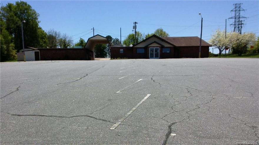Restaurant built in 1968.  But the freestanding building could have many uses.  Detached kitchen/storage building, detached cooler/freezer building, paved parking lot.  The layout includes a main dining room, 2 private dining rooms, kitchen, 4 restrooms, and 2 offices.