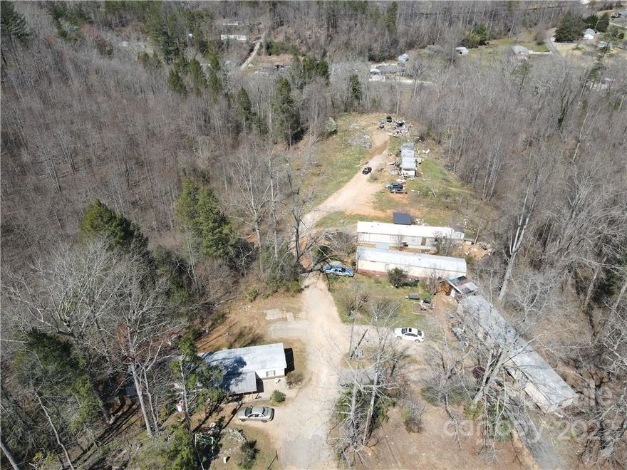 7.96 Acres in Nebo Township.  Currently set up for Mobile Home Park, with 7 lots. Has septic for 7 lots, well, and electric. No zoning, but under Mobile Home Park Ordinance. There are currently 5 mobile homes on property that are not owned by property owner but are subject to verbal lot lease.  

10 minutes from Lake James public boat access. 10 minutes from Lake James State Park. 7 minutes from Lake James Golf (Marion Lake Club). Approx. 5 miles from Marion, NC
Convenient to I-40 and Hwy 70