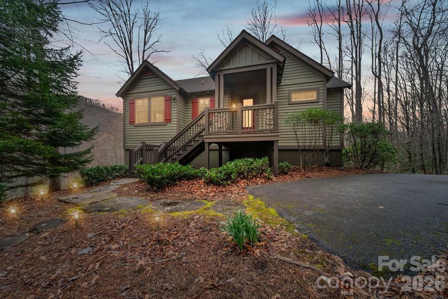 Tucked away in the breathtaking mountains of Tuckasegee, 142 Allspice Court offers the perfect blend of mountain charm, comfort, and resort-style living inside the gated community of Bear Lake Reserve. This charming cottage invites you to experience the beauty and tranquility of the Blue Ridge Mountains while enjoying the many amenities and activities that make Bear Lake Reserve such a sought-after destination.

Surrounded by lush forest and natural beauty, this home sits on a peaceful lot with added privacy and a gentle creek flowing nearby—creating the perfect backdrop for quiet mornings and relaxing evenings in the mountains.

Step inside to a warm and welcoming interior where beautiful hardwood floors and soaring vaulted ceilings highlight the open living and kitchen area. The space is ideal for entertaining or simply relaxing after a day of mountain adventures. A cozy stacked-stone gas fireplace anchors the living room, creating the perfect setting for cool mountain evenings and adding to the true cabin-in-the-mountains feel.

The main level offers convenient one-level living with a spacious primary suite, providing comfort and privacy. A guest bedroom and full bathroom are also located on this level, making it easy to host friends and family. Just off the living area, step onto the screened-in porch, where you can unwind while listening to the sounds of nature. This outdoor living space features a second wood-burning fireplace, making it an inviting spot to gather year-round.

Downstairs, the lower level expands the home’s living space with a large family room, perfect for movie nights, games, or extra gathering space. This level also includes a third bedroom featuring built-in bunk beds for four, creating a fun and functional sleeping area for guests or kids. A full bathroom and laundry room add convenience, while the second covered porch offers another peaceful place to relax and enjoy the surrounding mountain setting.

Located within Bear Lake Reserve, residents and guests enjoy access to a wealth of incredible amenities including, tennis, Jack Nicklaus 9-hole golf course, driving range, PICKLEBALL and other activities designed to create a true mountain lake resort lifestyle. From scenic Blue Ridge Mountain views and outdoor adventures to welcoming community spaces and hospitality, the experience here is unmatched. Whether you are looking for a full-time mountain retreat, vacation getaway, or investment property, this home offers the perfect opportunity.

Whether you're planning weekend escapes with friends, summer vacations with family, or simply a quiet retreat in the mountains, 142 Allspice Court delivers the elevated mountain lake living experience that makes Bear Lake Reserve so special.

Come discover the beauty, comfort, and unforgettable lifestyle waiting for you in the mountains of western North Carolina.