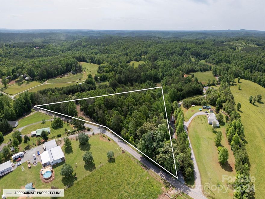4.2 UNRESTRICTED acres with nearly 800 ft. of paved road frontage. Gentle slope allows for multiple build sites and potential to subdivide into two or three lots.