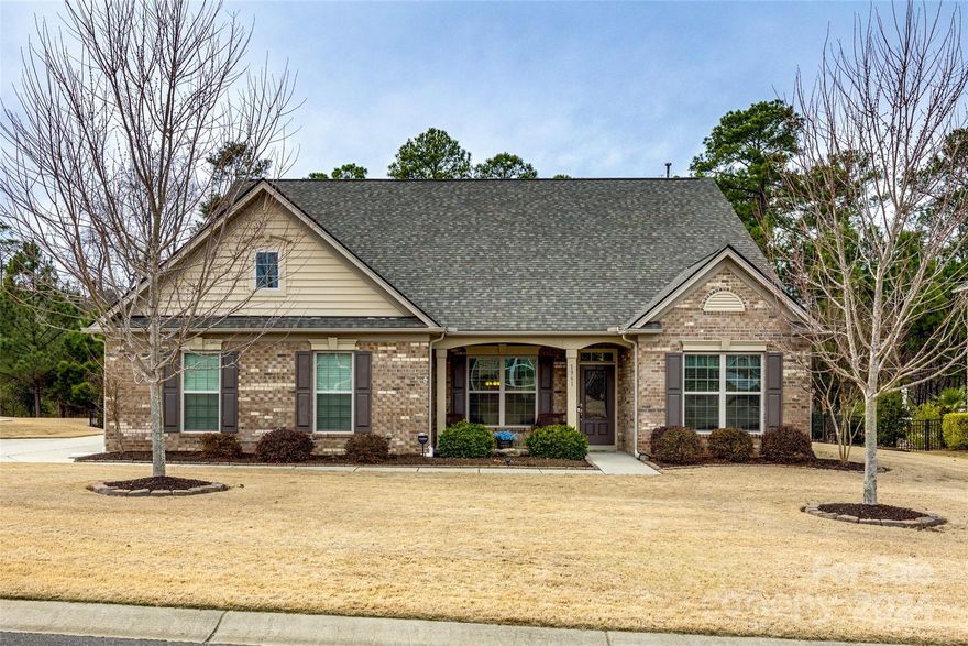 Come see this beautiful 3 bedroom home with a generous upper level bonus room, located on the Allison Creek Peninsula of Lake Wylie in Palm Tree Cove II! The newly renovated Allison Creek Park hosts a public boat launch, playground, and park with beautiful walking trails, and is located just about a mile away. You will fall in love with this 1.5 story ranch-style open floorplan, with 3 bedrooms on the main, including a spacious Primary Suite. The beautiful kitchen includes a large island, granite countertops, stainless appliances, and more. The home boasts a beautifully landscaped yard with an additional parking space for a boat. Minutes from the driveway to a day on the lake! The fenced backyard oasis includes a shed with power and a beautiful covered patio with built-in grill/cook area. The entertainment area continues with pavers leading to a stone fire pit and large hot tub, which includes a chiller and automatic sun shade for those hot summer days. Clover schools and low taxes!