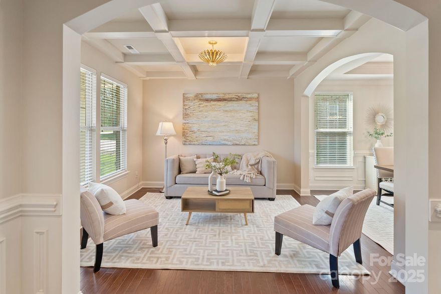 This energy star certified home offers a thoughtfully designed layout w/quality finishes. Main level w/ engineered hardwood floors, wrought iron railings, crown molding, wainscotting & decorative ceilings. Kitchen w/ Bosch appliances, including a wall oven, warming drawer & dishwasher, plus granite counters, gas cooktop & breakfast nook. Family room w/gas fireplace & built-in shelving. Guest bed & full bath complete main level. The primary suite offers a vaulted ceiling & walk-in closet w/built-in wall safe. Ensuite w/ a soaker tub & glass-enclosed walk-in shower. Versatile flex space is also located on the upper level, along w/3 additional bedrooms w/new carpet (2023), full bath & laundry room. Outside find a custom backyard, fully updated in 2023, w/ wooden deck, hardscaped areas & retaining wall—both w/accent lighting. Additional upgrades- energy-efficient windows, irrigation, garage storage closets & more!