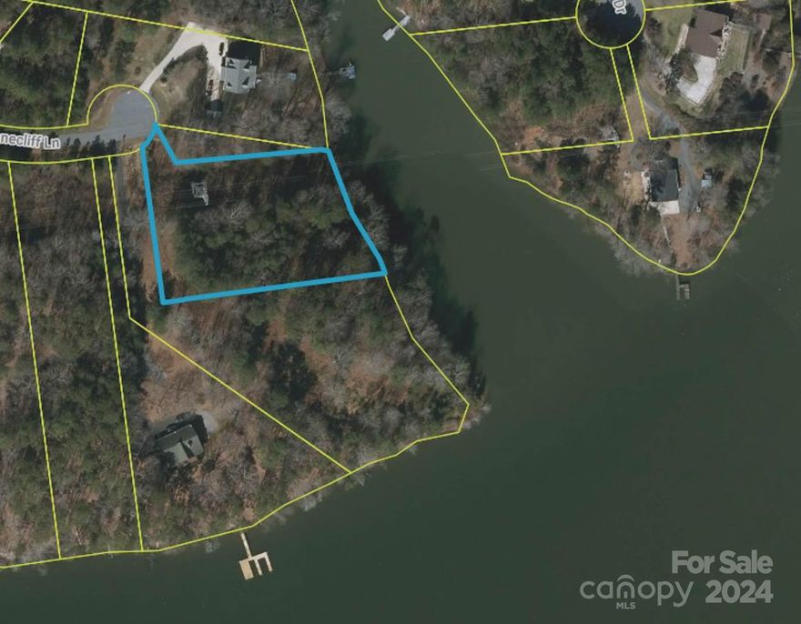 Enjoy this lakefront 1.34 Acre lot with over 210 feet of shoreline on Lake Lookout Shoals & long range views! The seller applied/received a septic permit for a 3BR home in 2022 (see Assoc. Docs). Dock Permit Approval letter has been issued from Duke Energy (see Assoc. Docs), as well as a survey that was done by Darrin Reid in 2022 (see Assoc. Docs). Gated community offers a community lake access, beach area, boat (DAY) slips, covered picnic area on beach, fishing, & fenced boat/RV storage, etc.  For more helpful info on subdivision, restrictions, etc. go to the RIVERWALK HOA/Community website at: https://lookoutriverwalk.com/. Duke Power line/tower easement on property (See Assoc. Docs). HOA fee for this lot is currently $431/year.