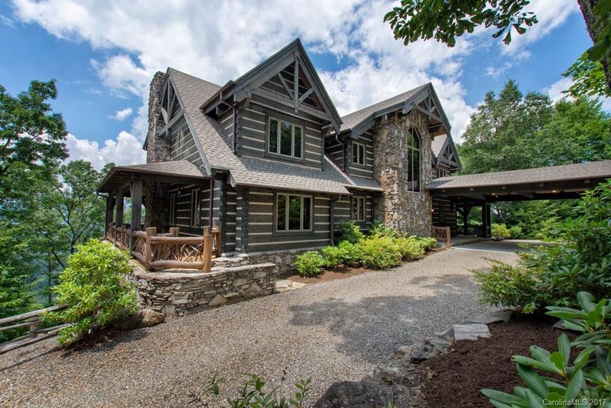 Enjoy serenity & spectacular year round mountain views from this exquisite lodge style log & stone residence located on a private & gated Mtn ridge-top.This impeccable log home features 6BR/6BA suites(4BR Septic),soaring wood ceilings,hand hewn beams,hickory floors,poplar bark accents,,expansive windows,professionally designed kitchen w/Wolf,Subzero & Bosch appliances,spacious family/recreation room,media room w/wet bar,level driveway, &INCLUDES exquisite high end designer furnishings.