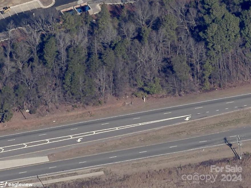 This prime commercial spot on the busy University City Boulevard approx. 2 1/2 miles from Charlotte Motor Speedway is available!  Recent 24 Hour TDOT report showed the traffic count as 53,040. Previous owner had ok to build a Retail Center & Car Wash on this land which is actually 2 parcels. Parcel #051-111-05 is 1.65+/- acres and Parcel # 051-111-47 is 2.7+/- acres for a total of 4.35+/- acres.  Parcel #051-111-05 is currently zoned B1CD.  Please consult with the Charlotte Planning & Zoning Department with any zoning or use questions. Seller will consider selling lots individually. Partial Seller-Financing may be available. Don't miss this great commercial opportunity!