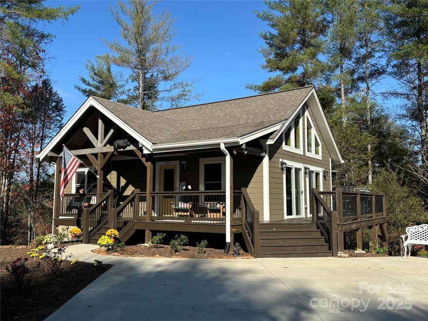 This SECLUDED home, which is MUCH LARGER THAN IT APPEARS has a picturesque view of Bee Mtn, & is nestled amongst trees. The wooden cathedral ceiling, wall of windows & wrap-around deck gives it that MOUNTAIN HOME feeling. The open concept Kitch w/9’ island is ideal for meal prep or entertaining. The spacious BR has walk-in closet & full bath. The lower Guest Area includes: Fam Rm, 2BRs & full bath. The Laundry Rm has plenty of storage space. This home comes w/matching shed big enough for a small UTV or workshop. You can enjoy outdoor living from any of the covered porches, decks or flagstone patio. This home is located near the gates closest to town w/just a 12 min drive to food shopping. The Coves is 3,200+acre gated community offering numerous amenities including: Lodge w/pool, tiki bar, fitness cnt, firepits; miles of hike/equest/UTV trails; kayak/tubing; picnic pavilion; vineyard/gardens; stables; Pickle Ball/Shuffle Board/Putting Green, just to name a few. Owner is a NC Realtor