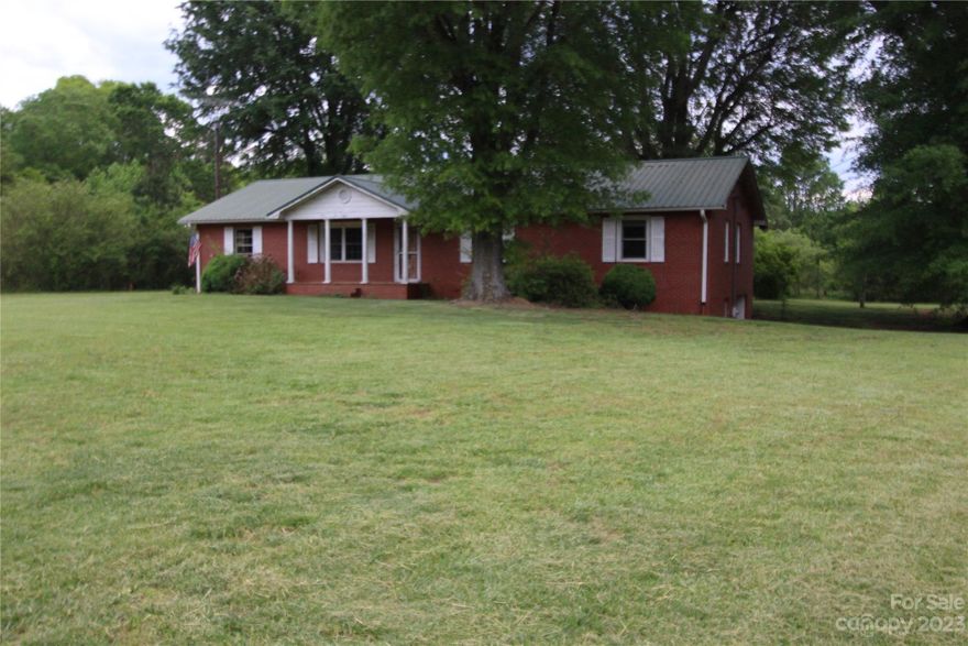 3 bedroom/2 bath brick rancher with full basement and garage.  Shop area in basement with garage door.  Huge oak trees with lots of play or recreational area.  Green open field or garden space with abundant wildlife.  Private 3.69 acres.  This property is being sold as is.