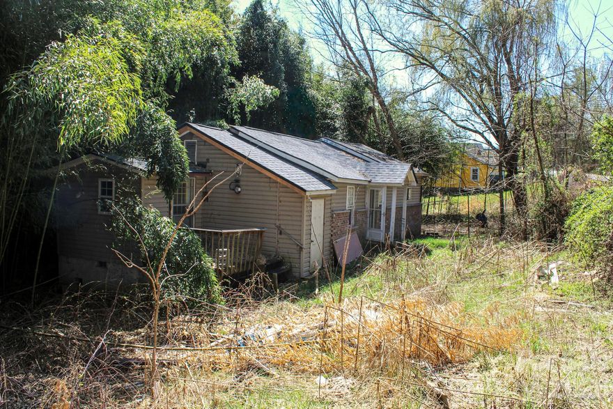 Opportunity knocks at 1293 Lake Logan Road in Canton. This property is ready for a complete transformation and is ideal for investors, builders, or buyers looking to create their own mountain retreat from the ground up. The home has already been taken mostly down to the studs, offering a blank slate to redesign and rebuild to your exact vision. A newer roof is already in place, saving on one of the major upfront expenses, but make no mistake that this property will require a full renovation from top to bottom. Situated just minutes from the scenic beauty of Lake Logan, this location offers the perfect blend of privacy and access to outdoor recreation, including hiking, fishing, and exploring the surrounding mountains. Whether you're looking to flip, hold as a rental, or build a personal getaway, the setting alone makes this a compelling investment. Bring your contractor and your vision as properties with this kind of potential and location don’t come around often.