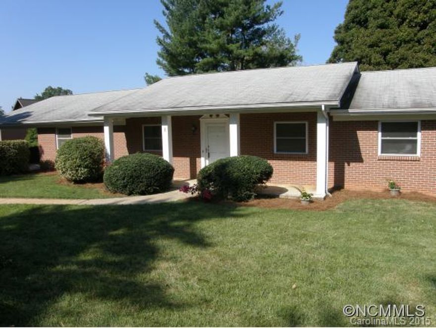 Location! Location! Location! Solid brick ranch right off Main St. in quaint downtown Weaverville. Large living room, formal dining room and eat-in kitchen. Den opens onto deck, great for entertaining! Full basement has partially finished office and bathroom not included in sq.ft. Could be nice in-law suite or possible apartment. Over-sized one car garage and tons of storage. Parcel is portion  of PIN#, see attached survey. Walk to everything!