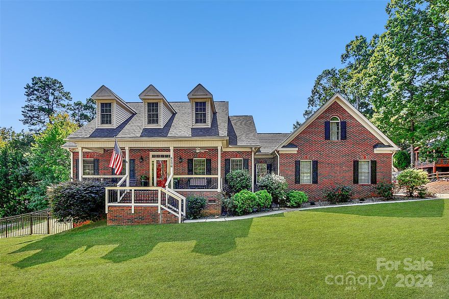 Beautiful BRICK home w/ VIEW of LAKE NORMAN nestled on a CUL-DE-SAC lot on over 1/2 ACRE in the desirable CHERRY LANDING community. 3 BRs/2.5 BA on MAIN FLOOR which is just under 2,000sf + an add'l 436sf upstairs (BONUS ROOM) - HARDWOODS in Dining & HARDWOODS in Living Room w/ CATHEDRAL CEILING & Fireplace. Kitchen includes CORIAN countertops, STAINLESS appliances (including refrigerator) - Breakfast nook w/ Large BAY WINDOW. Master Bedroom features TRAY CEILING & Master Bath w/ TILE floors, TILED SHOWER & TILED jetted tub. Laundry room on main w/ TILED half bath. Stairs lead to large 24' x 14' BONUS ROOM w/ BARN CEILING & full attic WALK-IN storage. Large MULTI-LEVEL, Partially covered DECK overlooking Beautiful IN-GROUND POOL - Completely landscaped and FENCED back yard. 3-car GARAGE has EPOXY floor w/ Spacious WORKSHOP. Washer & Dryer negotiable. No dock access BUT Public boat launch is just down Unity Church Rd at Beatty's Ford Park.