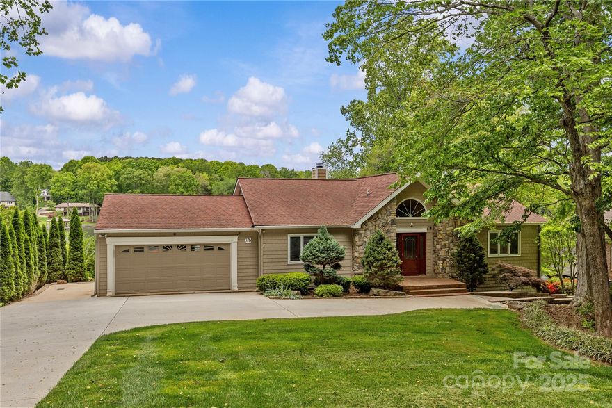 Enjoy wide water views from this beautifully landscaped property featuring a private dock, boat lift, and boathouse. The home offers multiple outdoor living spaces, including a spacious deck and a huge covered lower-level patio—perfect for relaxing and entertaining.Open-concept great room showcases breathtaking lake views and flows seamlessly into a generous dining area and a large kitchen, with abundant cabinet space, center island, SS appliances, and granite countertops.Atrium doors open from the living space onto the deck, offering an effortless indoor-outdoor connection. Main level includes a renovated primary suite with an updated bath, along with an additional bedroom. The lower level boasts a large bonus room, additional bedroom and full bath, a fantastic unfinished workshop area that offers easy potential for future expansion.Property combines beautifully maintained landscaping with incredible lakefront vistas, creating a special setting for everyday living or weekend getaways.