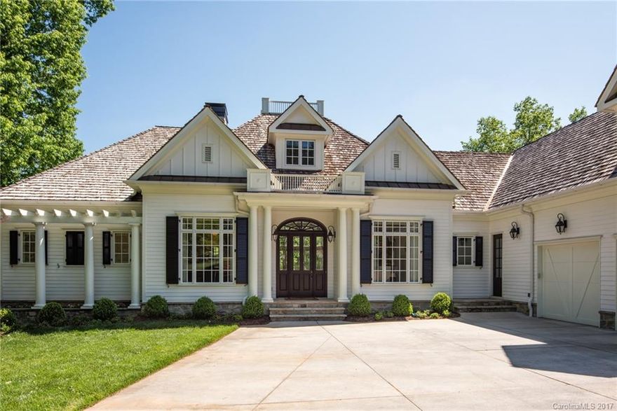 Timeless elegance characterizes this coastal style waterfront home located on a quiet cul de sac within walking distance to the Peninsula Club.  Living room opens onto expansive upper balcony overlooking resort style pool with great lake views.  Chef’s kitchen features soap stone countertops, oversized marble and walnut butcher block island, wolf double oven with 6 burner stove top, pot filler, farmhouse sink & subway tile backsplash. Lower level recreation area is perfect for entertaining.