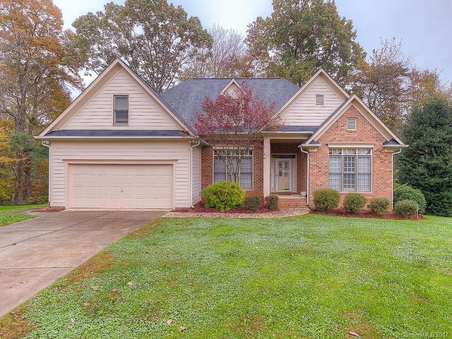 This lovely home is located in the heart of Fort Mill on one of the largest lots in the neighborhood! .47 of an acre... on the culdesac. Wonderful open floor plan with Master bedroom downstairs. Some upgrades include beautiful Brazillian cherry hardwood floors on main with new carpet throughout, plantation shutters and new roof in 2011. Home is within close proximity to walking trails, Peach stand, main street, and I-77.