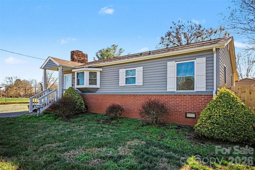 Welcome home to this charming 3-bedroom, 1.5-bath ranch that blends comfort, functionality, and outdoor space. This well-maintained home offers a practical single-level layout with inviting living areas and tasteful updates throughout.

Inside, you’ll find a bright and welcoming living room highlighted by hardwood floors, a cozy fireplace, and plenty of natural light. The kitchen features white cabinetry, stainless steel appliances and a convenient island, opening nicely into the dining area—perfect for everyday living and entertaining. Three comfortable bedrooms provide flexibility for guests, a home office, or growing needs, while the full bath and additional half bath add everyday convenience.

Step outside to enjoy the fully fenced backyard, ideal for relaxing, pets, or outdoor gatherings. An above-ground pool adds a fun bonus for warm Carolina days. The detached one-car garage with workshop space provides excellent storage and room for hobbies, projects, or extra equipment.

Conveniently located near local amenities, schools, and major routes, this home is a wonderful opportunity for first-time buyers or anyone looking for easy, one-level living with outdoor perks. Don’t miss the chance to make this inviting property your own!