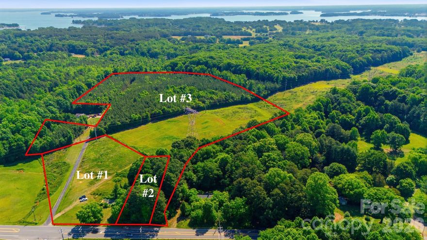Positioned in the heart of one of Denver's fastest-evolving growth corridors, this approximately 33.53± acre assemblage consisting of parcels 31852, 34480, and 34479 presents a strategic opportunity for future development and long-term investment. The property is currently zoned R-T and located within the Eastern Lincoln Development District (ELDD) overlay. County water is available to all three parcels.

Located directly across from Cambridge Village — home to Publix, retail, dining, service-based businesses, and the Avril Cambridge Village apartment complex — the area continues seeing significant residential and commercial expansion fueled by population growth, strong commuter access, infrastructure discussions, and increasing demand throughout the Lake Norman market.

The property is also located within the WS-IV Protected Area of the Catawba/Mountain Island Lake Watershed. Residential development is subject to watershed density limitations of 3.0 units per acre for single-family and two-family development, or 2.0 units per acre where curb and gutter are installed. Other permitted residential and nonresidential uses are subject to maximum impervious surface limitations of 36%, or 24% where curb and gutter are installed. A potential 10/70 watershed option may allow certain qualifying nonresidential projects to achieve up to 70% impervious surface coverage through special use permit approval on a project-by-project basis by the Board of Commissioners.

The site falls within an area designated by Lincoln County’s Land Use Plan as a future “Walkable Activity Center,” supporting long-term planning objectives centered around thoughtful growth, connectivity, mixed-use concepts, and community-oriented development patterns. See attached PDF info regarding this designation.

Commercial development would require rezoning. Commercial projects exceeding 50,000 square feet would require rezoning to Planned Development-Commercial or Planned Development-Industrial depending upon proposed use. Mixed-use concepts would require Planned Development-Mixed Use rezoning. Residential projects proposing 50 or more dwelling units would require Planned Development-Residential rezoning.

Lincoln County recently approved updates to the Unified Development Ordinance (UDO) on 5/18/26, including combining the ELDD permitted use table with the base zoning permitted use table to streamline classification and improve usability for staff and the development community. This revised UDO can be found in the attachments as well.

This is not a simple plug-and-play development tract. Buyers should conduct thorough due diligence regarding zoning, rezoning pathways, watershed regulations, utility availability, roadway improvements, environmental conditions, development standards, and all county approvals important to buyer’s intended use.

This is not just raw land — this is a strategic land position in eastern Lincoln County. An opportunity for the right buyer to help shape what comes next for Denver of the East while establishing a lasting presence that can impact this community for generations to come. As Denver continues evolving, opportunities to influence the long-term direction of upward momentum in this market are becoming increasingly limited.

Existing structures are being sold as-is. Do not enter home on property- the roof is unsafe and the property is a tear down. Deeded easements and utility easements exist. Buyers to verify all information important to their intended use. More photos coming soon of the Cambridge Village retail center.