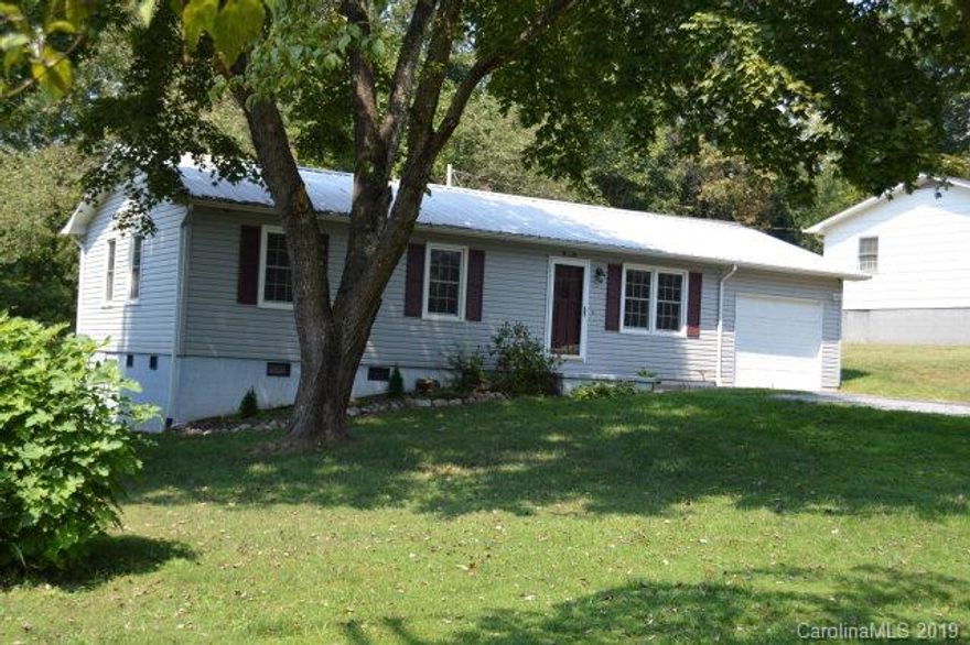 MOTIVATED SELLER!!Located within 10 minutes from Lake James, this lovely ranch home sits on a level lot.  Many upgrades have been completed in this 3 bedroom, 1 bath home and feels like NEW. This home boasts of hardwood floors throughout living spaces with ceramic tile in kitchen and bathroom. Kitchen features newer matching stainless steel appliances, refrigerator, range/oven, dishwasher & microwave. Some additional improvements included are whole house interior painting recently completed, New heat pump and ducts installed in 2010. Whole house security system is a 4 way Samsung video system. Metal roof was installed in 2010 as well. Matching washer and dryer convey. The exterior of the home features a one car garage with electric garage door openers with epoxy floors, large deck and a 12x12 outbuilding. This is a must see!! Call today!!