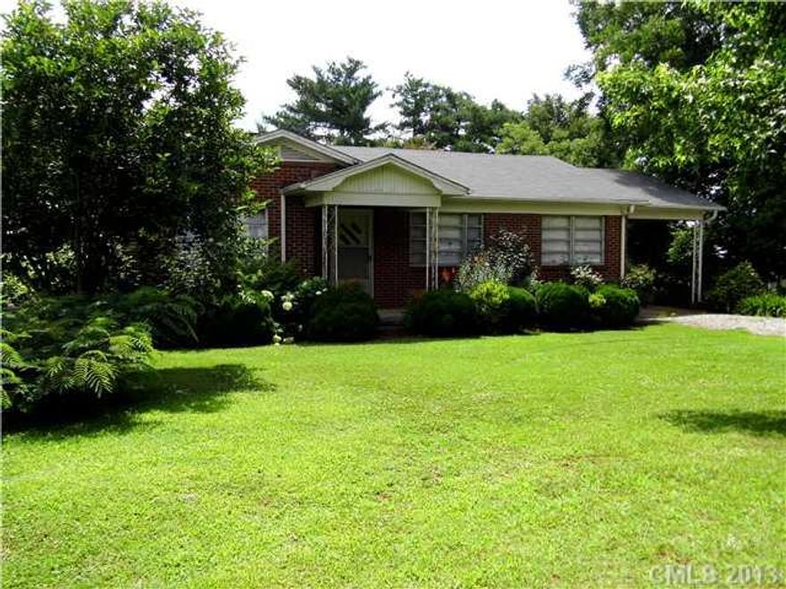 This property offers lots of uses to a buyer & almost 30K under tax value! Zoned RC (rural commercial), however current use is residential single family. All brick house with basement, 2 bdrm with living space & permit for 3rd. Large corner location with beautiful plants, shrubs & fruit trees. Great location for home based business or commercial enterprise. Close to Bandys High School.