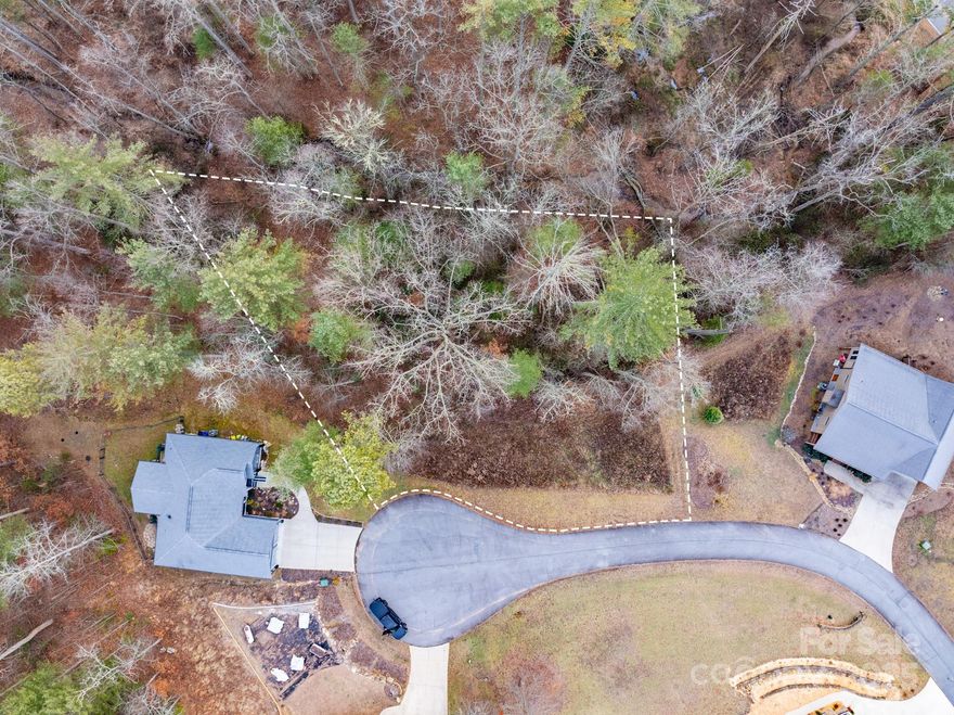 Lot 4 in Crystal Cove is conveniently located just 15 minutes west of Hendersonville, 7 minutes from Etowah, and about 20 minutes from both Brevard and the Asheville Regional Airport. The property has paved access and a gentle slope, allowing you to build a minimum 1,500 sq ft home with either a walkout basement or crawl space. Both site-built homes and off-frame modulars are permitted. A 300-foot stream borders the back of the lot, adding a peaceful natural feature.

Utilities include a septic system, city water, high-speed wired internet, underground power, and propane. Crystal Cove is part of a well-established community with paved roads and a 2.5-acre pond with walking trails. Residents can enjoy fishing, paddling, and regular sightings of local wildlife such as turkey, waterfowl, deer, and the occasional black bear.

Call today to schedule a showing or request more information.