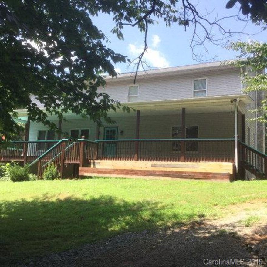 This 3328 square foot home with a full basement gives you all the space you should need to live comfortably in the middle of 11.72 acres. Beautiful hardwood floors and tile lets you know how solid this home is. Beautiful wood cabinets trim out the kitchen and baths. A beautiful rock fireplace adds so much to the large family room and I almost forgot about how really big the walk-in closets are. The really nice country stairway and the floor plan layout make this home people friendly. You also have a large deck that wraps around the whole house. A  full basement of over 1600 Sq Ft with a nice wood stove with glass doors so you can enjoy the winter months. There is a very nice creek on the property which enhances the value of this home. A three car detached Garage for your vehicles and a small barn for extra storage or other use.