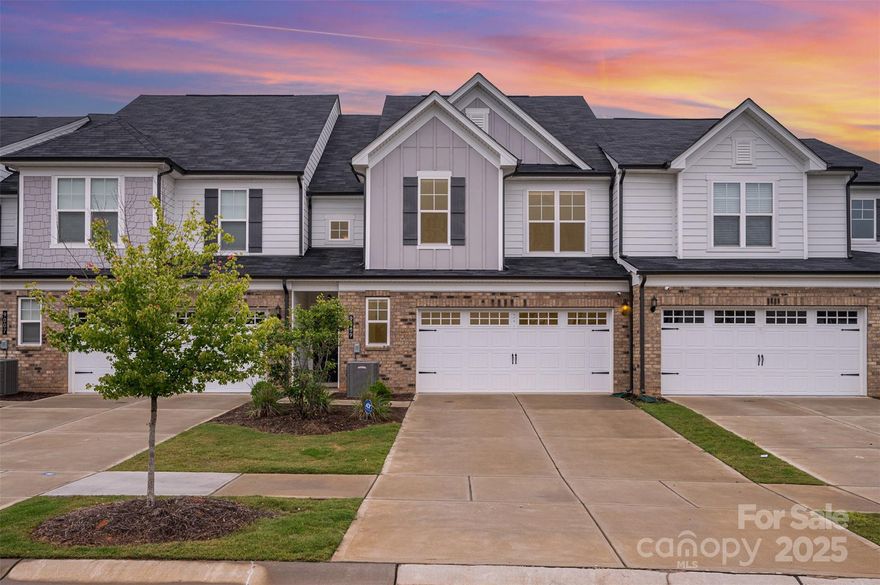 Experience turnkey living at its finest in this beautifully designed townhome, ideally located near everything Concord and Charlotte have to offer! Step inside to a bright, open layout featuring a stunning entertainer’s island, pristine granite countertops, and sleek stainless steel appliances. Natural light pours in, highlighting the clean, modern finishes throughout the home. The spacious primary suite offers a relaxing retreat, complete with a tiled walk-in shower, dual vanities, and a generous walk-in closet. Two additional bedrooms provide flexibility for guests, office space, or family, and the convenient upstairs laundry nook adds everyday ease.
Located just minutes from Concord Mills Mall, with easy access to I-85 and I-77, this home keeps you close to premier shopping, dining, and entertainment. Enjoy low-maintenance living with no lawn care required—just move in and start living! Welcome home to comfort, style, and convenience all in one place!