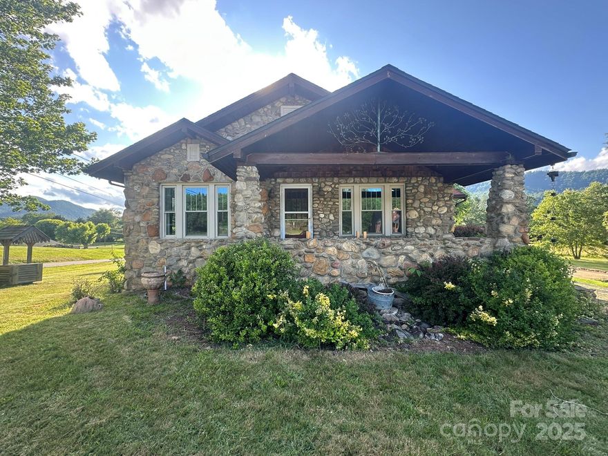 Nestled on a spacious 0.67-acre lot, this beautifully crafted 3-bedroom, 1-bath stone home offers timeless character and breathtaking mountain views from nearly every angle. From the moment you arrive, you'll be welcomed by a covered front porch perfect for relaxing mornings, as well as a covered side porch ideal for year-round enjoyment.

Step out back to a large deck where you can take in the expansive natural beauty—perfect for entertaining or simply unwinding in peace. The property also features a detached garage, providing extra storage or workshop potential.

With its classic stone construction and views, this home combines charm, comfort, and outdoor living in one perfect package. Don’t miss your chance to own a piece of tranquility with easy access to nature and everyday conveniences.