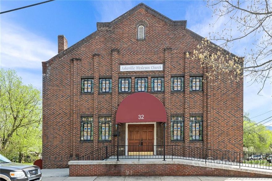 Stunning historic property located in the heart of West Asheville with significant road frontage along Richmond Ave. and Pennsylvania Ave.  This listing consists of two separate corner lot parcels.  Parcel 1 is .36 acres and includes the 3 story brick building used previously as a church.  Stained glass windows, loft and original brickwork and details make this a one of a kind treasure.  The original structure was built in 1916 and a later addition to the rear of the building added classrooms and offices for a total gross building area of 12,124 sq. ft.   The second parcel is approximately 1.08 acres and contains a 1200 sq. ft. stone home and a 2200 sq. ft community meeting building.  Currently zoned RM-8 this property is ideal for a single family, multifamily development and/or a creative repurposing of the historic building.