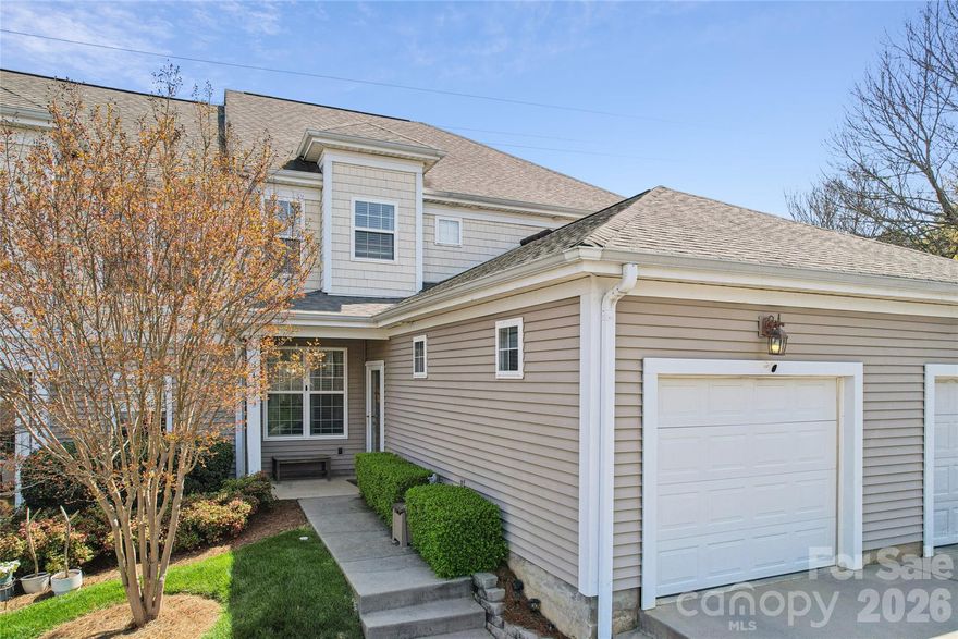 Experience the perfect blend of style and seclusion in this stunning townhome. The open-concept main level features gorgeous flooring and a unique see-through fireplace that elegantly bridges the living and dining spaces. Retreat to the private primary suite, boasting dual closets and a spa-like bathroom with a garden tub.

Step outside to your own private oasis: a screened-in porch and connected deck framed by towering mature cedars. Whether you’re hosting a summer BBQ or enjoying a quiet morning in the loft, this home offers the space and serenity you've been looking for.