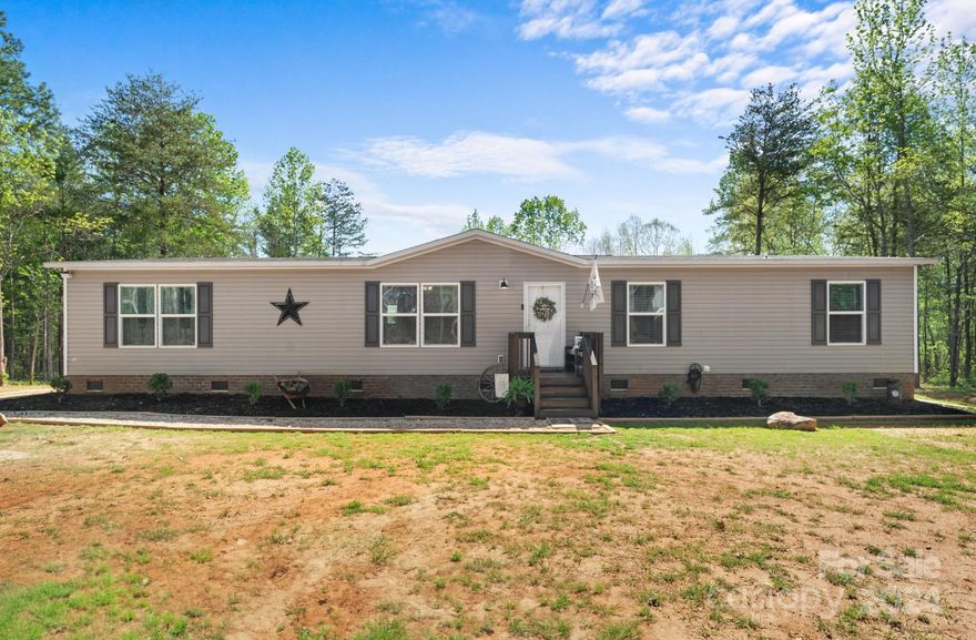 Step inside and discover a warm and inviting farmhouse-style home, filled with natural light that creates a cozy atmosphere for you and your loved ones. This home features 4 bedrooms, 3 bathrooms and a versatile bonus room.  The heart of the home lies in the expansive kitchen, featuring a large island and open floor plan, perfect for both culinary delights and entertaining guests. The primary suite has a walk-in closet and an oversized garden tub & separate shower. Outside, embrace the freedom of outdoor living on 5 acres of land where nature's symphony plays out against breathtaking views and vibrant sunsets. Conveniently located near Hwy 5, enjoy the tranquility of rural living without sacrificing urban accessibility. Whether you seek a peaceful retreat, a space to grow and thrive, or simply a canvas to bring your vision to life, this home offers the perfect blend of comfort, style, and freedom – your dream home awaits!