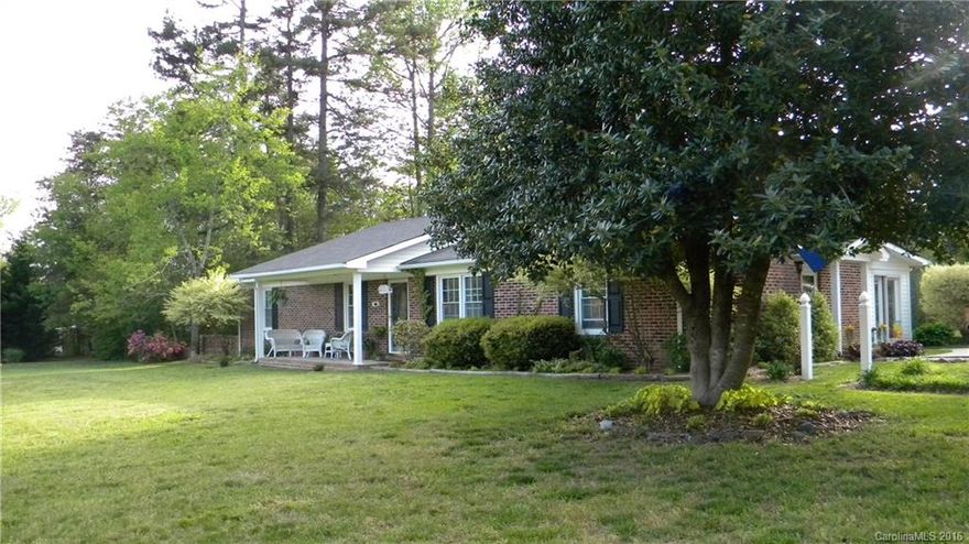 Lovely home remodeled perfectly.  Enjoy this home in the country, open and airy, large rooms, immaculate and ready to move in.  Sunroom overlooks lovely yard with flowers and trees.  The garage could be a 2 car but set up as workshop and 1 car garage.  Area fenced for pets beside garage and great area for a garden.