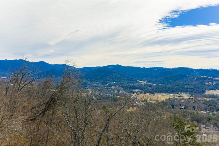 Gorgeous panoramic views from this mountain top lot, conveniently located in The Summit at Hamburg Mountain. This exceptional neighborhood is the perfect place  to design your dream home. Minutes to charming downtown Weaverville with shops, dining, coffee, breweries, grocery and easy access to the interstate.