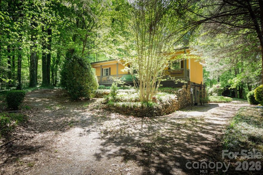 This charming 2-bedroom, 3-bath home offers a peaceful setting just outside Newton with plenty of space to enjoy both inside and out. Start your mornings on the covered front porch or unwind on the back deck overlooking a yard where the landscaping blends right into the natural surroundings. Upstairs features an open kitchen, dining, and living area that feels comfortable and connected, great for everyday living or having people over. Downstairs, the basement adds extra finished space with a potential third bedroom for guests, a home office, or hobby room. A one-car garage with a workshop and extra storage space adds functionality and convenience. Outdoor features include irrigation throughout the property, a small decorative pond with a recirculating waterfall feature, and multiple outbuildings. A powered shed and rear carport offer excellent space for storage, projects, or additional covered parking.