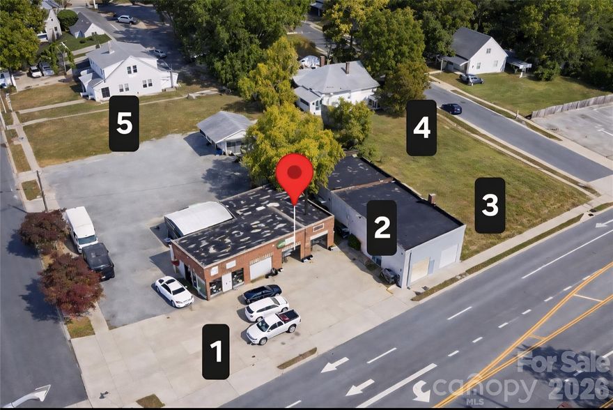 Commercial Development Package:  5 Lots, 2 Buildings in a growing area of Gastonia.  3 side road frontage:  224.32' on W Franklin Blvd, 215.73' on S Firestone and 127' on S Dalton totaling 567.05', 0.89 ac.  Two buildings 1872sf, 2784sf totaling 4656sf.  Ceiling range from 9'-12',  4 Bays, Garage doors ranging 8'-11' height.  Walking distance to the FUSE district and facing the historic Loray Mill complex.  Very Accessible, Great Visibility and Convenient.
5 Lots, 2 Bldgs PID:  106167, 106166, 106170, 106171, 106165 i.e.  1108 W Franklin, 1104 Dalton, 110 S Firestone, Lot-Dalton