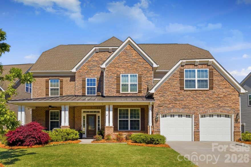 Stunning 6-bedroom, 4.1-bath cul-de-sac home with a private backyard retreat in one of the area’s most sought-after communities. Showcasing timeless Craftsman architecture, the home’s inviting front elevation is highlighted by rich stone and brick detailing and an expansive covered sitting porch, perfect for morning coffee, evening unwinding, or welcoming guests in style.

Filled with natural light, the open-concept layout is designed for both everyday living and entertaining. The chef’s kitchen is a true centerpiece, featuring abundant white and antique-glazed cabinetry, beautiful granite countertops, a double-oven, and an oversized island, all flowing seamlessly into the main living areas.

The second floor offers four spacious bedrooms, including dual primary suites, each with walk-in closets, along with a flexible room that easily functions as a bonus or media space. The third floor expands the home even further with an additional bedroom, full bath, and versatile bonus area, perfect for guests, a home office, or recreation.

Step outside to your own private retreat, complete with a screened-in porch, expansive hardscape patio, and ample space for entertaining or relaxing. The backyard also offers generous green space and backs directly to scenic walking trails leading to the community pool.

Ideally located just minutes from Downtown Kannapolis, Davidson, and Huntersville, this home combines space, functionality, and lifestyle in one exceptional offering.