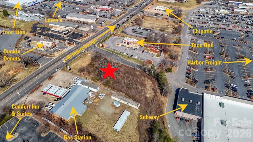 Large commercial lot with desirable location in Morganton, NC! This lot is over 1 acre in size & mostly clear with level topography & tons of visibility! Lot is located directly off I-40 & provides ample road frontage on one of Morganton's busiest 4-lane highways. City water & sewer available, tap fee required. Suitable for a wide range of commercial uses, see permitted use table in attachments for more details. Tons of commercial development nearby including retail shopping centers, multi-family & hospitality! Lot is located just outside city limits, no city taxes paid. Also convenient to Hickory, Lenoir & Marion. Do not miss this opportunity, contact listing agents for more information!