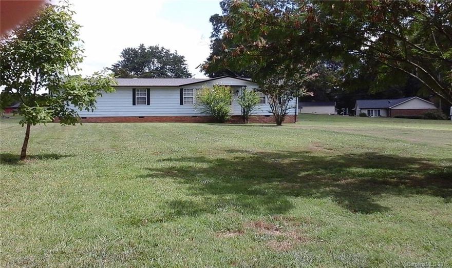 Spacious home on .53ac level lot in a tucked-away yet convenient location near shopping & interstates. Applianced kitchen open to great room with fpl. Separate den too. Master suite with garden tub & stand up shower, dressing table & walk-in closet. 2 car carport & storage building. Laminate & vinyl floor throughout.