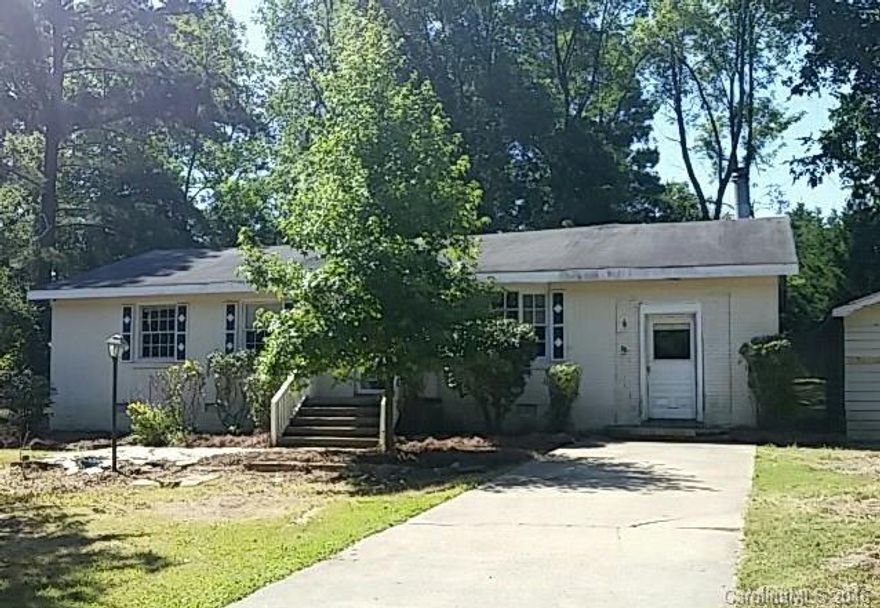 Cute ranch home on a flat lot with a lot of mature trees.