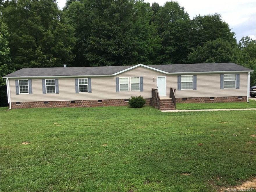 New carpet, New paint, fireplace in den,  Soaker tub in master bathroom, 6x6 porch on front, 2 covered porches on back.