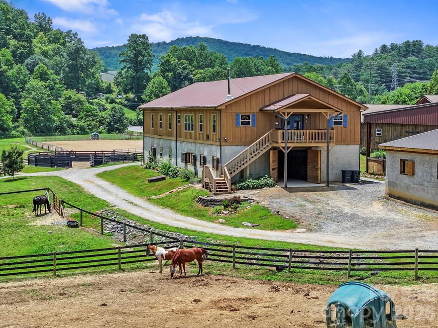 Discover your equestrian paradise on this exceptional 10.59-acre farm positioned in Horse Shoe, close to both DuPont and Pisgah Forests. World Class facility combines professional-grade amenities w/comfortable living, creating an ideal haven for horse enthusiasts and professionals alike. Established Boarding Business
in place, insulated training barn offers 10 12x12 stalls and 2 12x16 stalls, tack room,
2 hot&cold wash racks, hay storage and a covered 140x80 indoor 4 season/all
weather lit arena w/an upper level viewing room. 160x240 sq ft outdoor lit arena,
round pen, multiple pastures w/run-in sheds, and tractor/shavings/tool shed w/3
add'l stalls. Main Barn offers 10 14x12 stalls, climate-controlled tack room w/full
bath&wash rack. 3600sqft of living space above main barn w/2 living quarters, allowing for VRBO or housing a trainer. Mud room w/separate entrance. Trailer and RV hook ups on site w/power, water and separate septic is great for HorseHotel options. See Features List