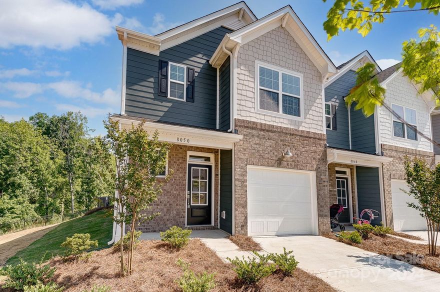 Welcome to Windhaven, a master-planned community of new townhomes in Tega Cay, SC, now sold out! Explore the popular Carlton end unit plan with 3 bedrooms and 2.5 baths. Step into the open-concept design featuring a dining area, living room with a gas fireplace, and a spacious kitchen with a quartz island, brand-new stainless steel appliances, subway tile backsplash, and LVP flooring on the main level. The second floor includes three generously sized bedrooms, two full baths, and a laundry room with a new washer and dryer. Enjoy your outdoor space on the patio. This prime Tega Cay location offers easy access to Interstate 77, shopping, dining, and recreational activities. Don’t miss this stunning townhome! Seller offering $5,000 in concessions to buyer!