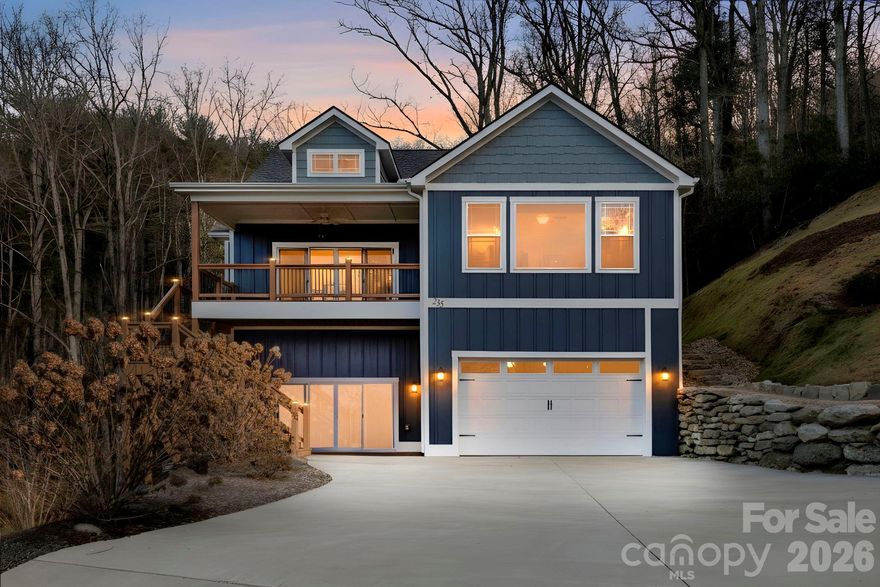 Soak in unforgettable sunset views from the front porch, great room, and bonus room, where dramatic floor-to-ceiling windows frame sweeping long-range mountain vistas. An open layout allows the living spaces to flow effortlessly, with expansive windows throughout the home capturing the beauty of the surrounding landscape at every turn. Please note: the driveway is steep and may feel intimidating on your first approach. After a time or two, it quickly becomes second nature, and there is ample space to turn around at the top. The home features three bedrooms, three full bathrooms, and an additional office, offering flexibility for work, guests, or hobbies. The kitchen is equipped with stainless steel appliances, a gas range, and granite countertops—ideal for both everyday meals and entertaining. A gas fireplace brings warmth and ambiance to the main living area on cooler evenings. The lower level offers generous storage, a billiard room, and a recreation area complete with a private patio and minibar, perfect for hosting or relaxing. Multiple outdoor living spaces, including decks, patios, and a screened-in porch, allow you to fully enjoy the Western North Carolina climate in every season.