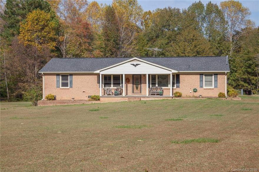 Won't last Clover Schools-Brick ranch on 4.33 acres LOW taxes! Custom mill-work throughout home.Cedar lined custom closets, full wood interior doors, custom kitchen cabinets w pull out shelves. Custom finished wainscoting- dining area, den& hallway. Built in cabinets in hall bath. Built-in cabinet in spare bedroom.  Vinyl replacement windows w-stained trim. Stone propane FP  in den, covered Front porch, Sun porch, 40x40 SHOP (wired & heated) w-closed in sheds, office space.  HVAC 2011/Roof 2009